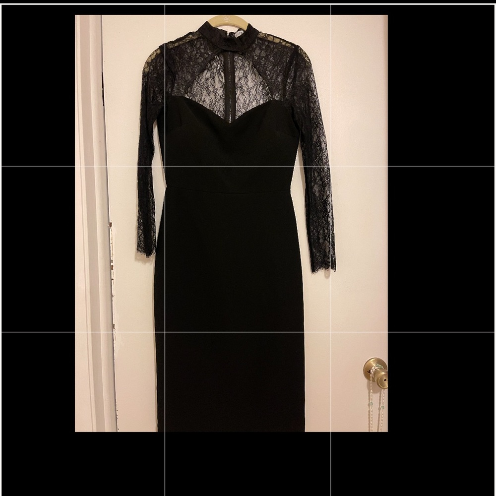 Alice and Olivia black A line dress. Open neckline. Little bit of lace trimming